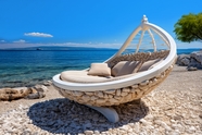 蓝色海岸创意白色躺椅摄影图片